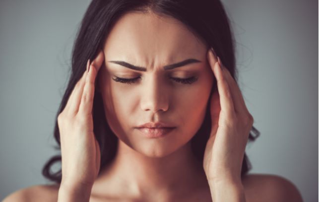 Women experiencing headaches due to dry eye
