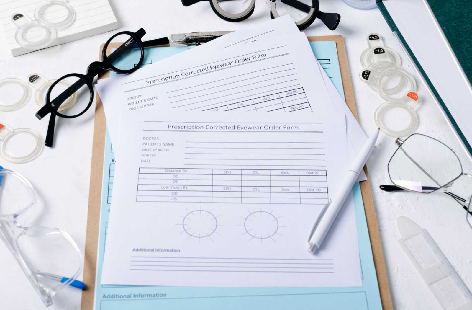 Eye prescription form with clipboard sitting on a desk at the optometrist office.