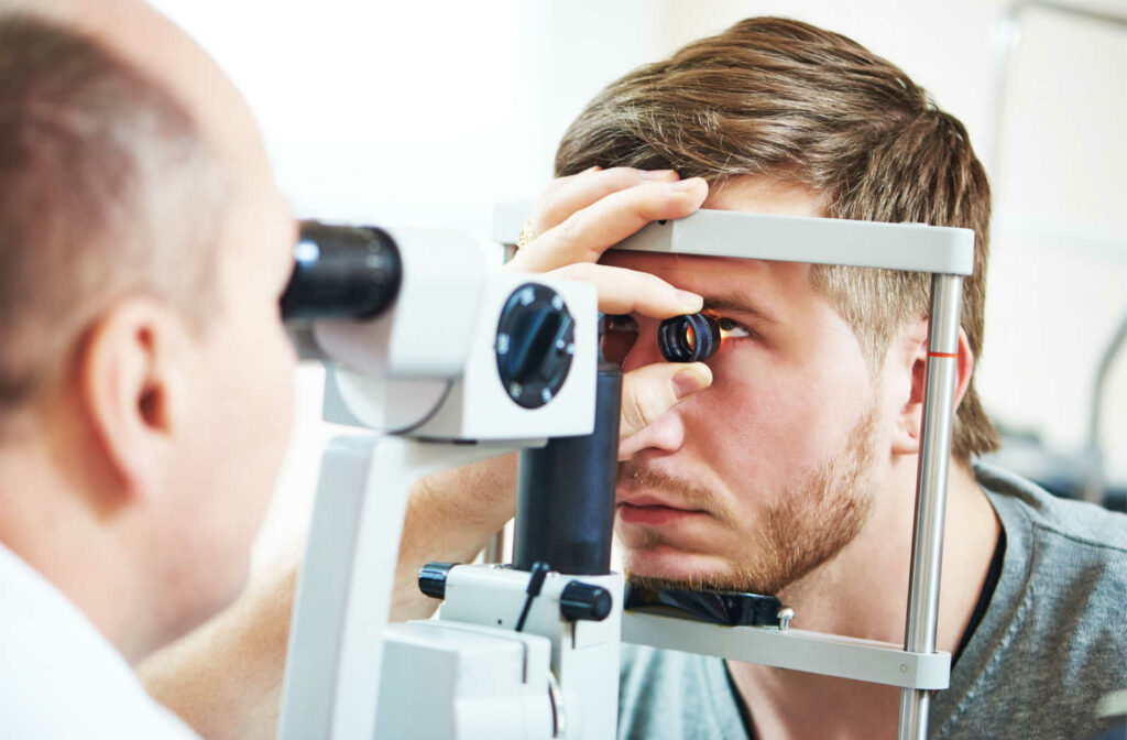 Male patient being examined with a slit lamp.
