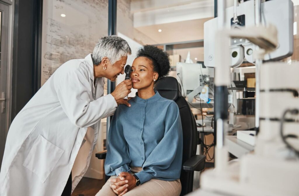 An optometrist examining a patients eye.